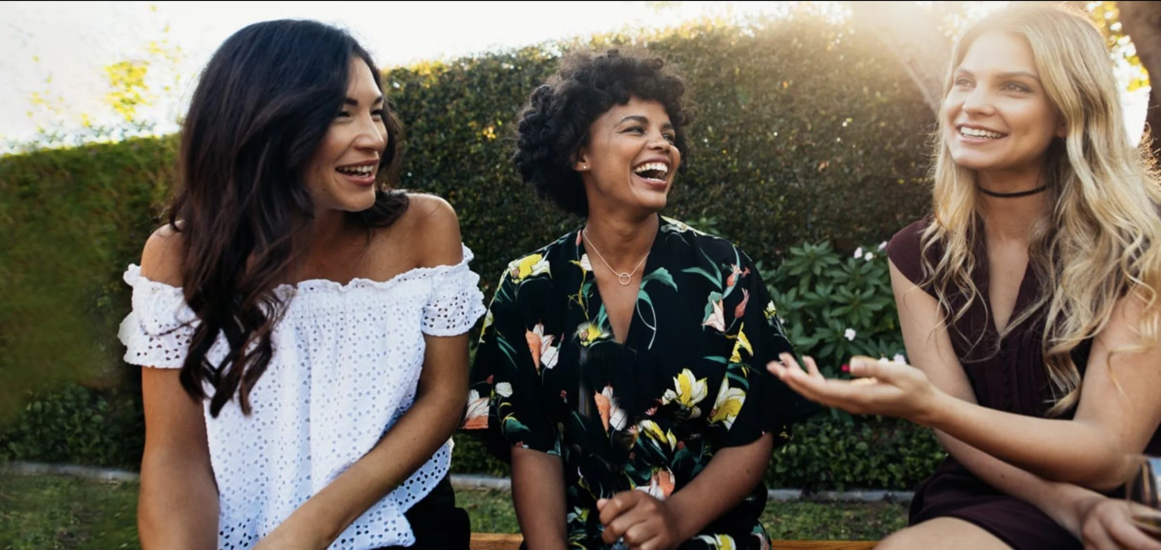 Friends laughing champagne outdoors_no glass.jpg