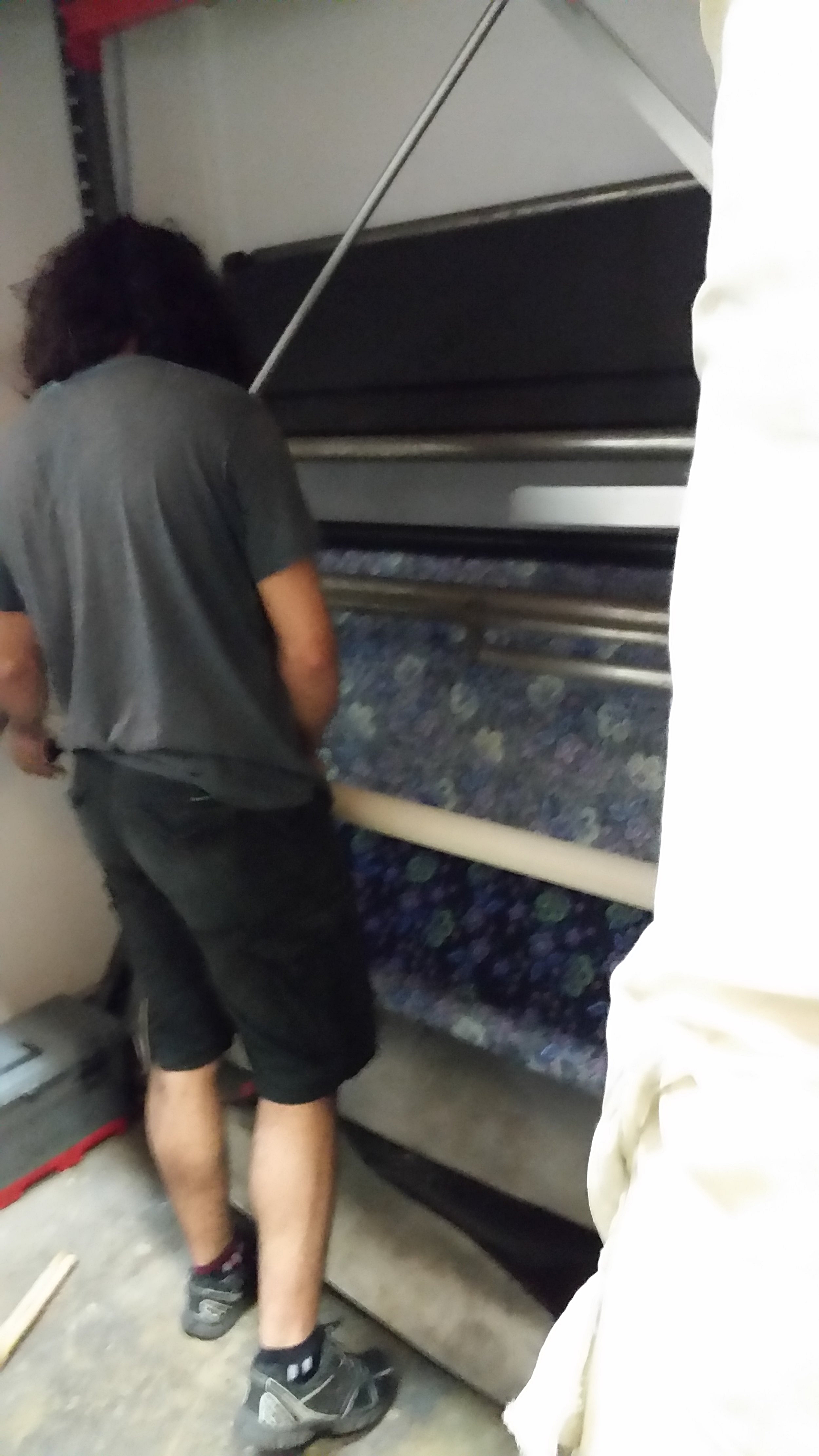 Here's the son, watching the fabric roll smoothly onto the round bolt. I never did see the spot where it returned a final inch or yard count on the bolt.
