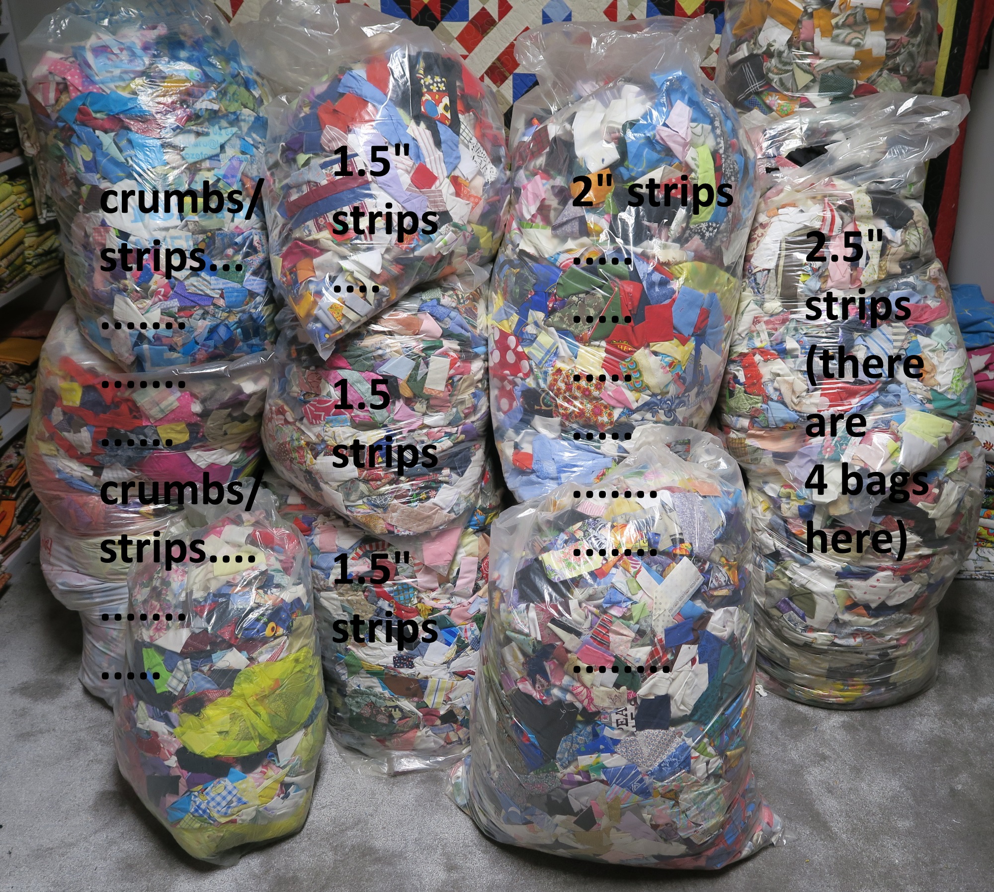 I do have something like 4 bags of crumbs and strips. That is crazy! But I'd rather have them in this form than in the previous form! This way they are quite usable - even it means I have to pull strips out of bags. I know many of you sort yours by colors - maybe at some point I will do that. I'm sure they would take less space if they were rolled into nice neat piles. Maybe someday if I get too tired of sewing I'll tackle that. It would be pretty cool, actually, to have them all stacked in boxes like that.