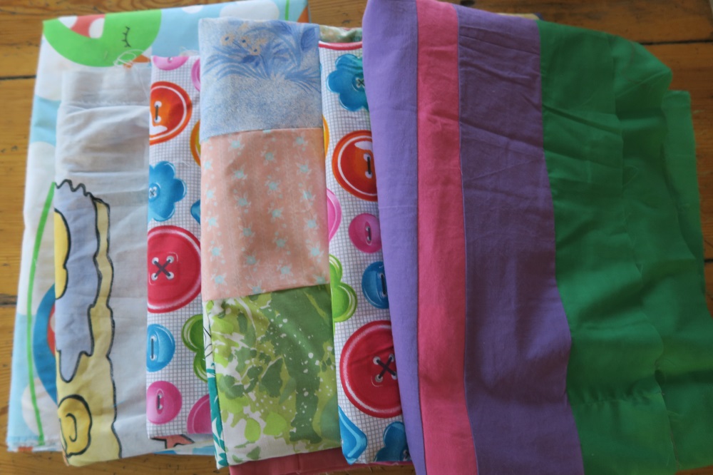 These are some European singles that are ready to sandwich. Each of these will be reversible since I'm using one big large piece of fabric I purchased here in Poland.