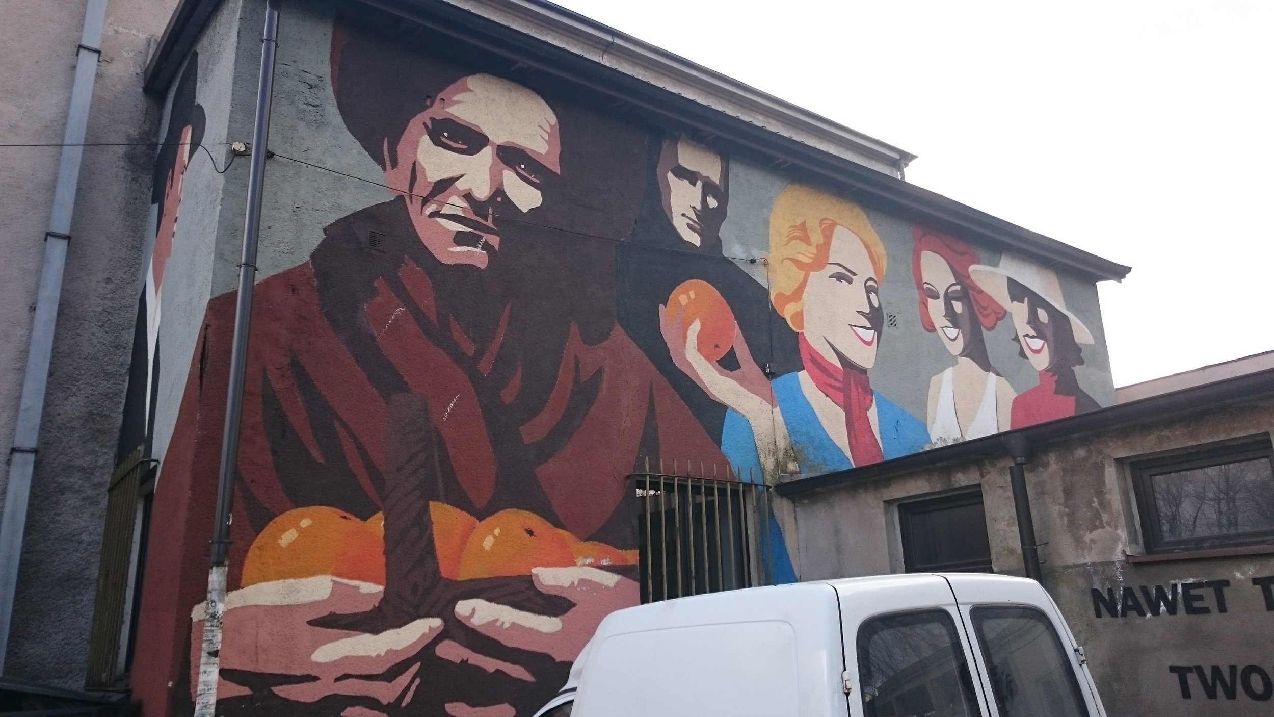 This mural is painted on the side of a building across from the memorial shown below.