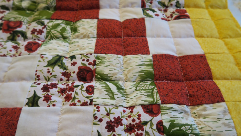 With these that my friend in AZ made, I just chose to split the squares in half with quilting. It gives the illusion that there are more squares than there are. I just eyeball it, though - I don't draw lines or anything. That would take too long!