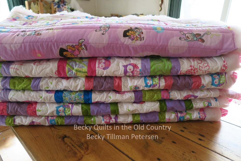 Here you can see straight line quilting, loop de loops and stippling.