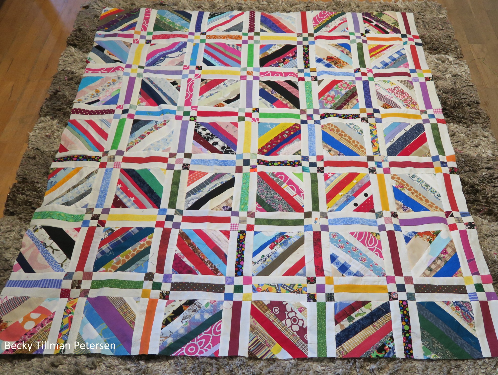 It's currently 54"x62" - getting to be a nice lap quilt size. Last week it felt like a baby quilt, so I'm making progress. 