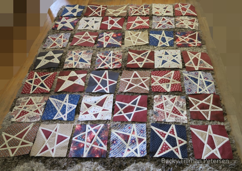 This was before the final layout. I was trying to mix up reds, and then the busy backgrounds, spread the blues around, change the direction of the stars. I had help with a student who was at our house for dinner - he moved some around as well.