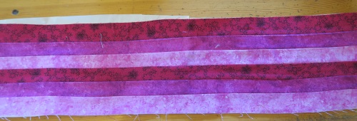 First, make a piece of fabric form 1 1/2" strips - in a variegated color scheme. 