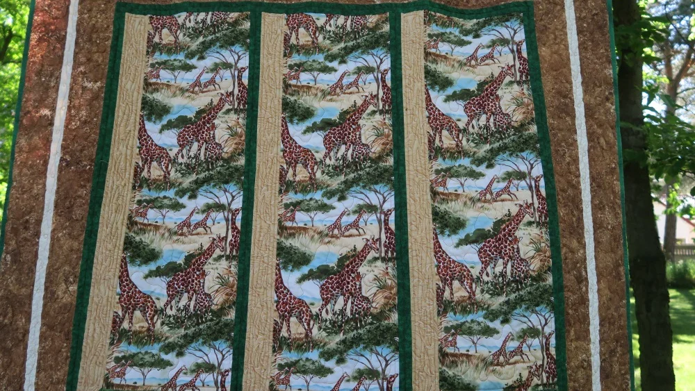 Here you should be able to see the quilting on the tan on the edge of the window frame. It's the first time I've done anything like this. I was trying to go for a wood grain effect.