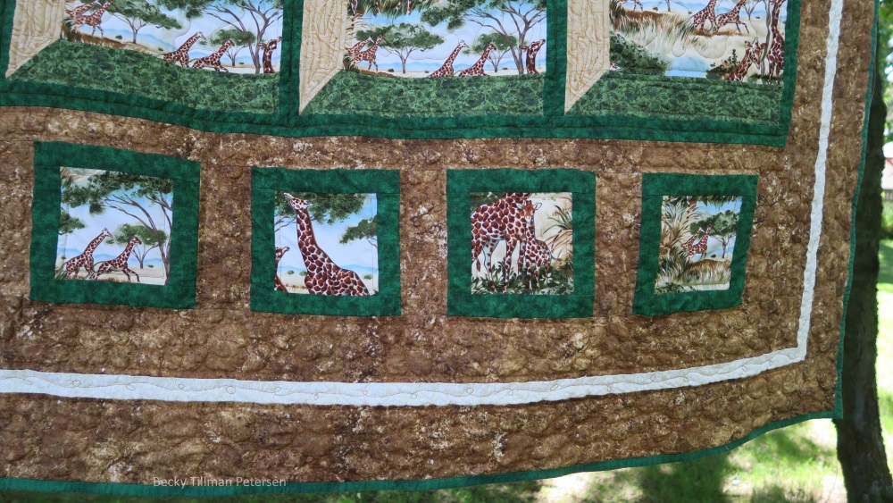 I quilted with pebbles around the frame - because the fabric I used here was called "Stonehenge" - it is wonderful fabric and I thought it appropriate if I made it pebbles and rocks.