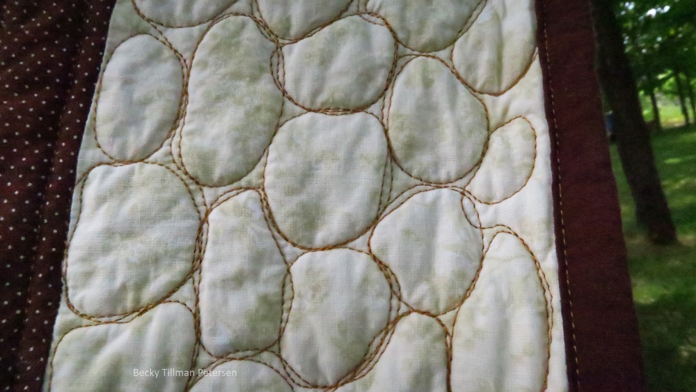 I'm exposing just how primitively I make pebbles. However, the overall effect is what I was going for. And I like it in spite of its imperfect pebbles. When I realized that the effect of a rock wall is the same with imperfect and perfect pebbles, it freed up my mind to enjoy making them!