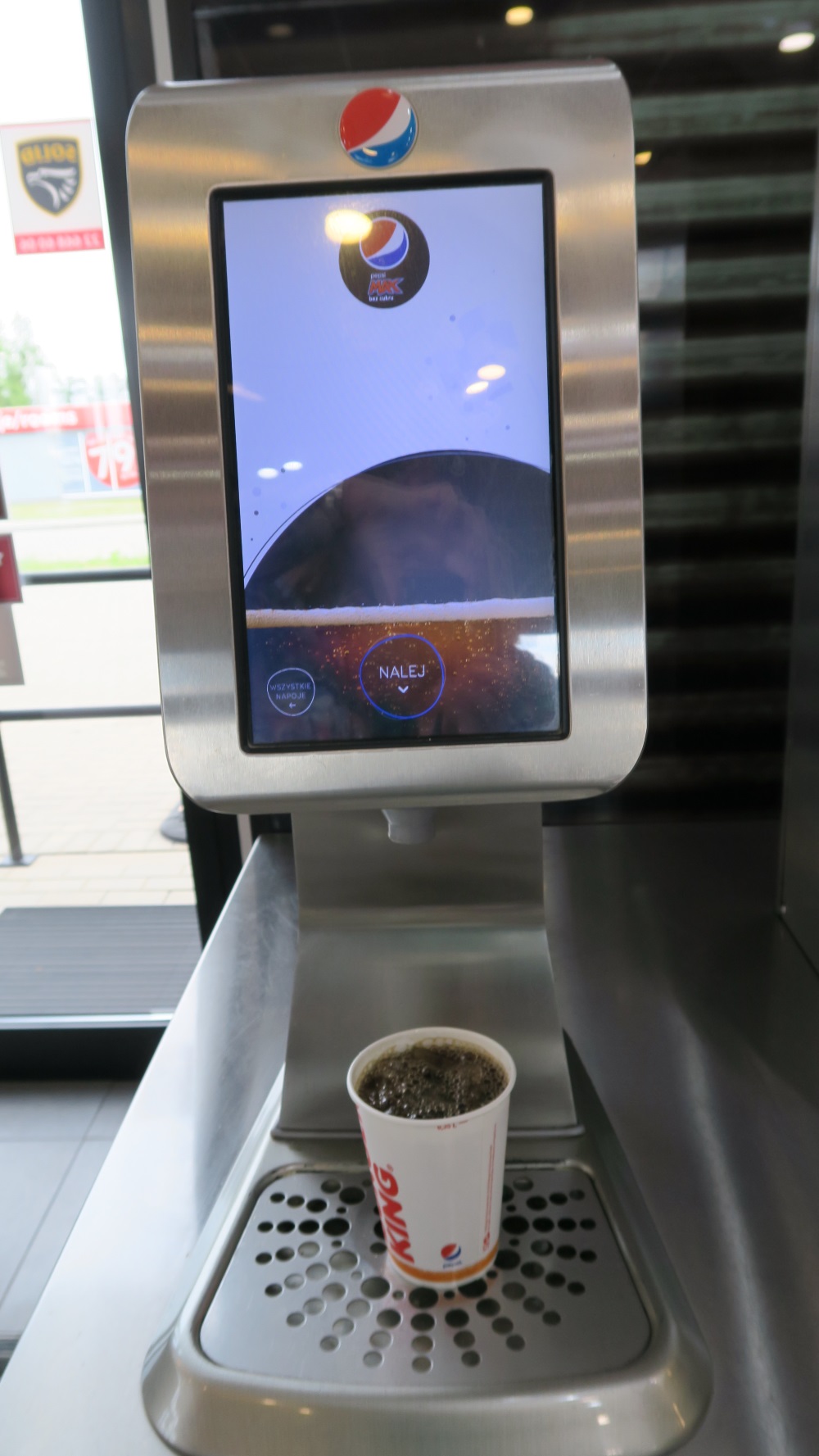 Drink machine. The cup is a tiny bit bigger than your water cup in the states. I think it holds about 300 gram or just over a cup of liquid.
