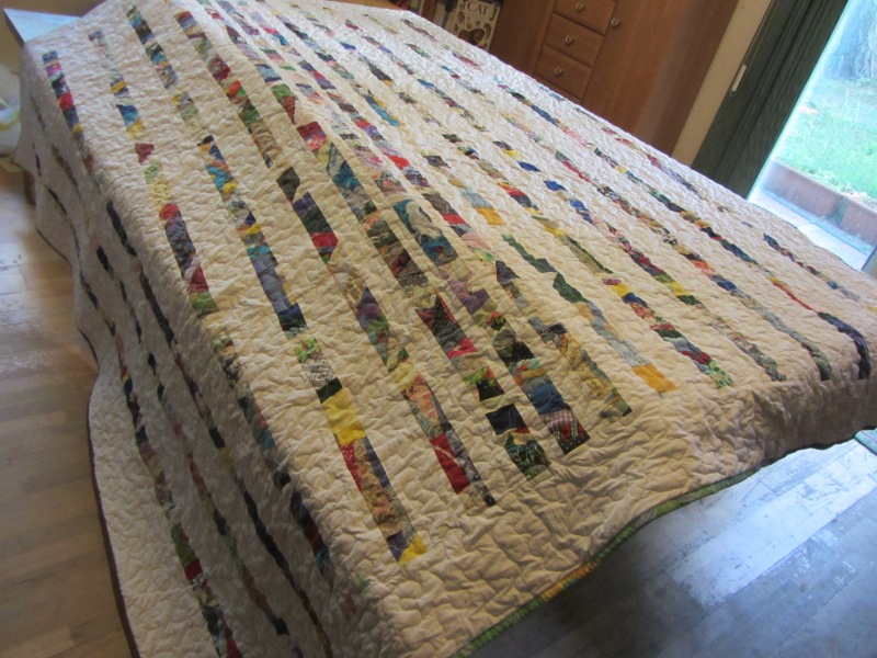 With this one, I used narrow strips, but I spaced them wider as I went toward the edge of the quilt.