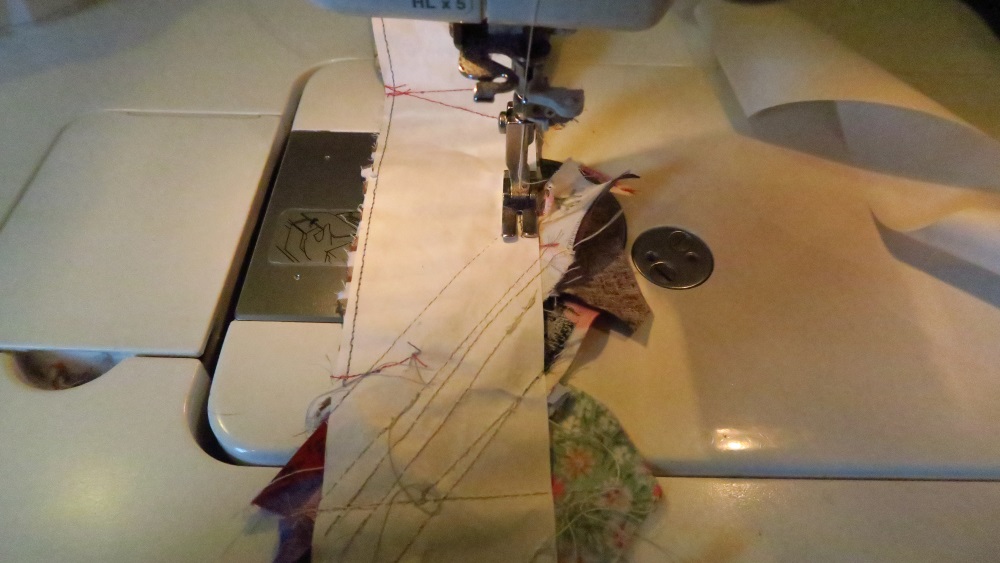 When I felt like stopping for the day, I turned over the strip and sewed in from the edge 1/8". Yes, it will dull your needle. My needle already felt dull.