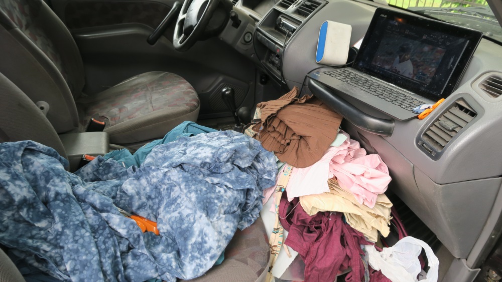 I'm using the front seat as a work space while waiting for my husband. He's inside a nearby building checking out a milling machine (no he didn't buy it - but did want to see it).