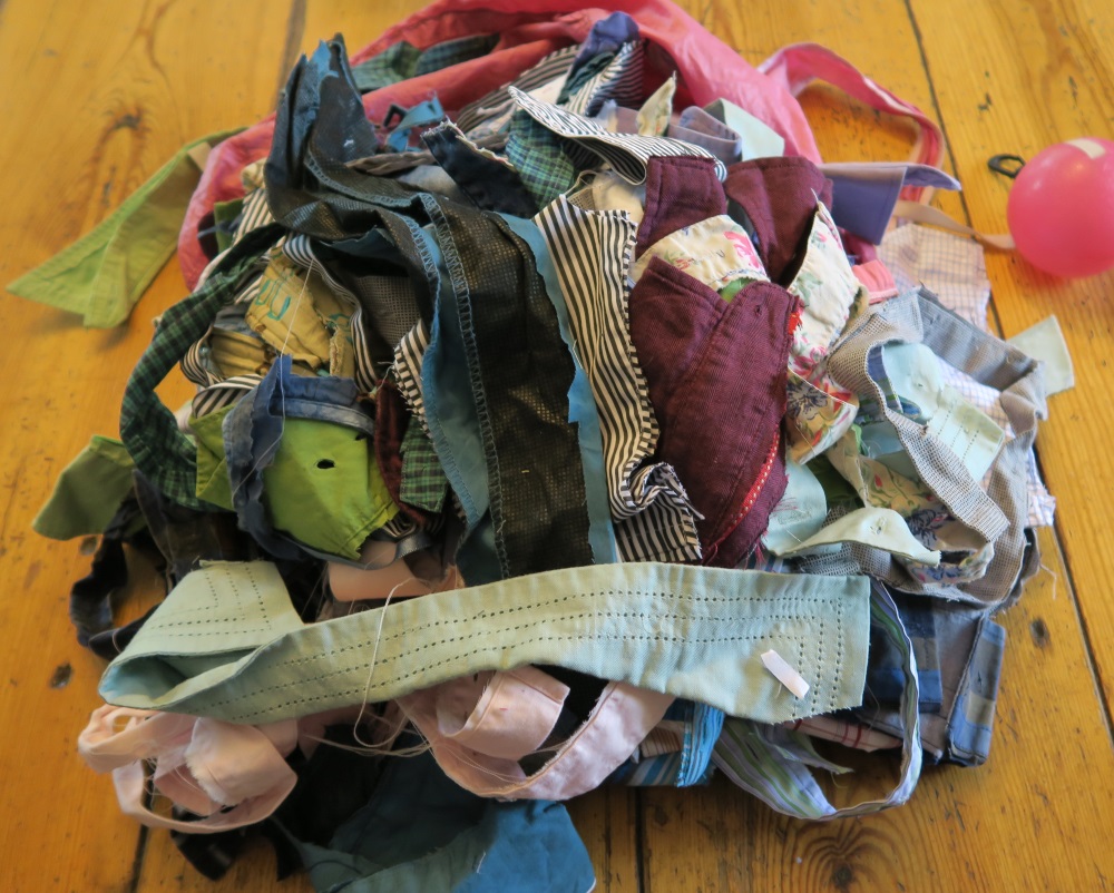 I COULD use parts of these pieces, but I've decided not to worry about it. These things all have interfacing fused to them and I don't want to spend more time on them. I don't have anyone locally who would like them to give them to or I would. They went into the kindling bag.