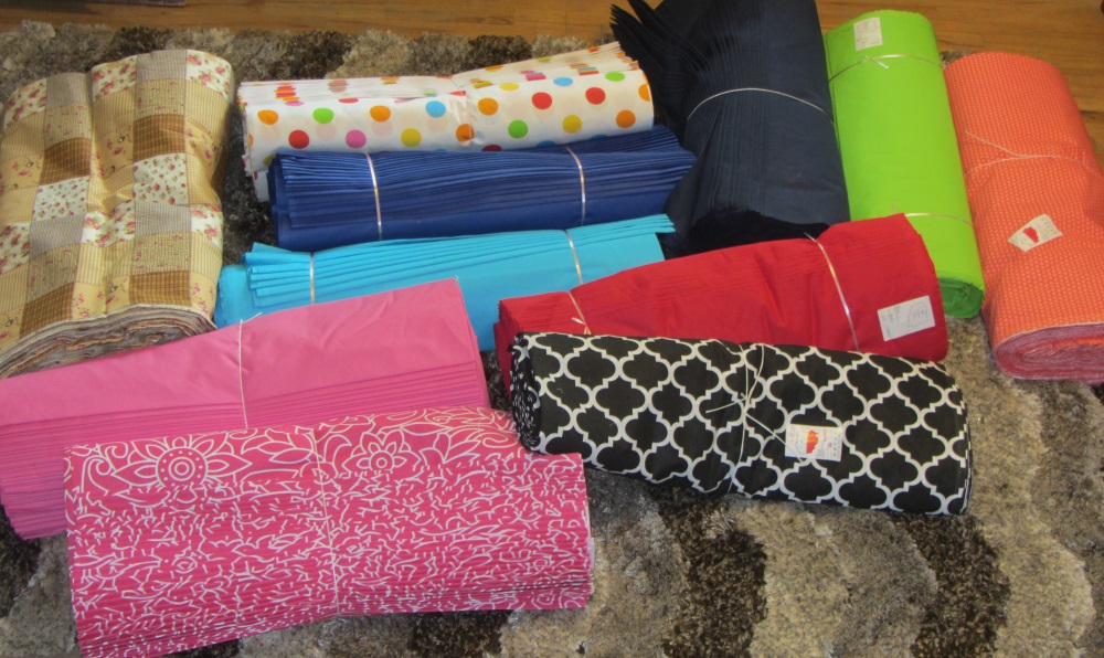 As you look at this picture, you can see some solids and some printed fabrics. As of this writing the printed fabrics are gone - almost all used as backings for charity quilts. I still have some of the solids. I bought this back in June, 2015.