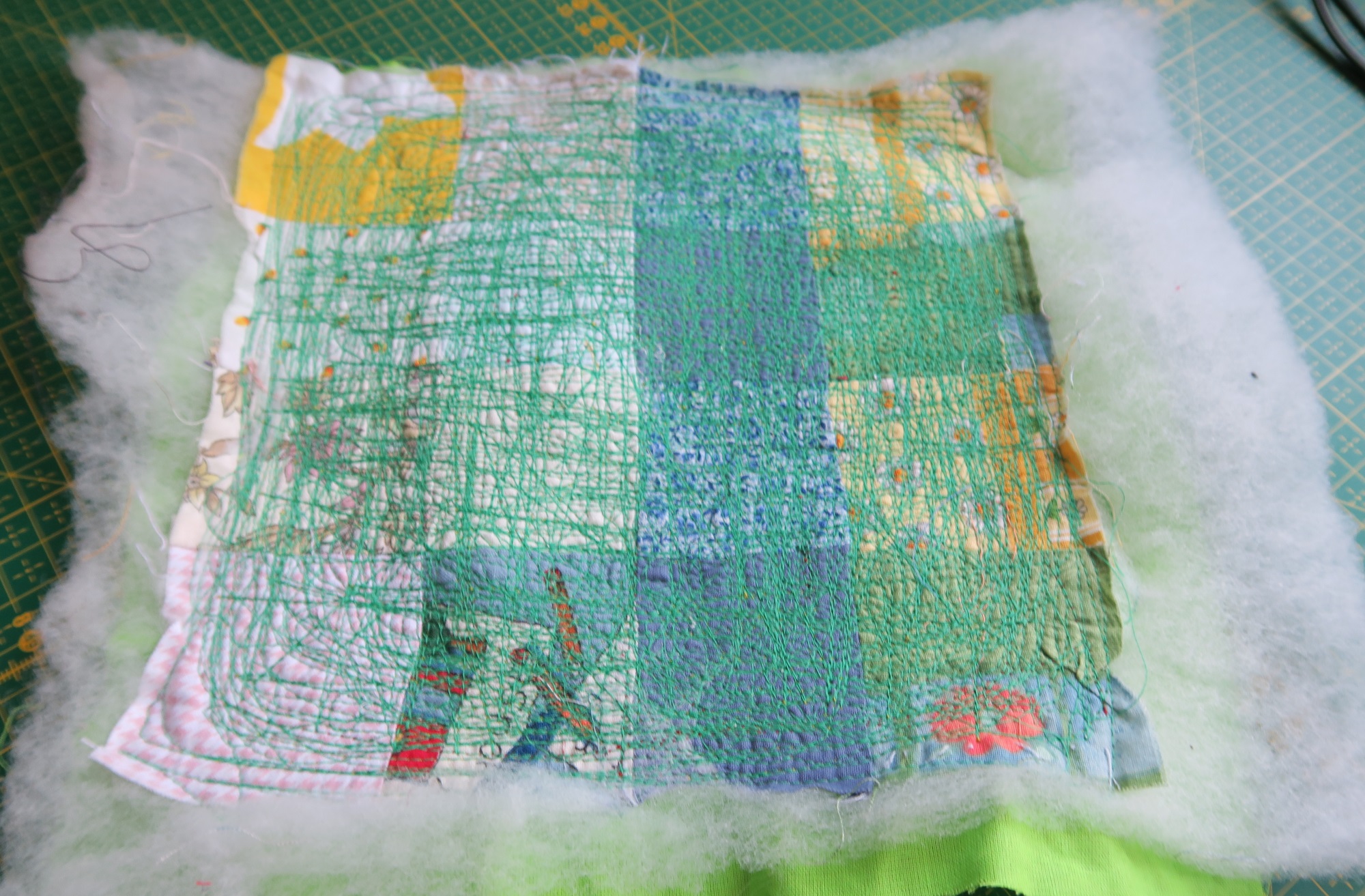 This QAYG (quilt as you go) block came back from the sewing machine repair place truly "quilted to death". No doubt they used it to test the machine after they replaced the sensor!