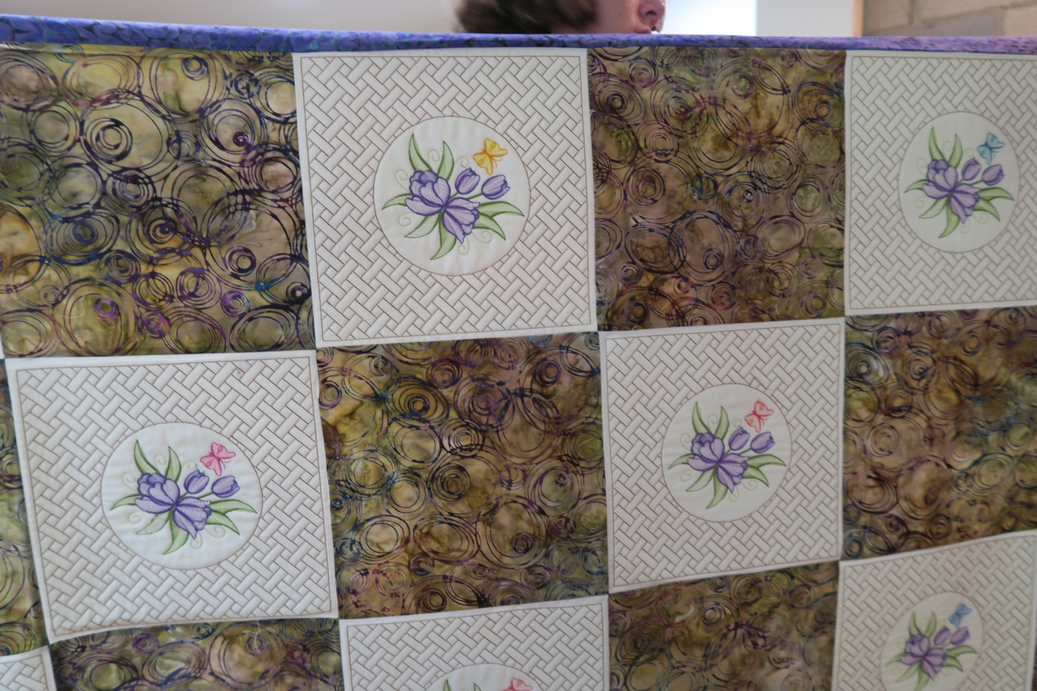 This is a quilt April is making for her mother. The embroidery is delightful!