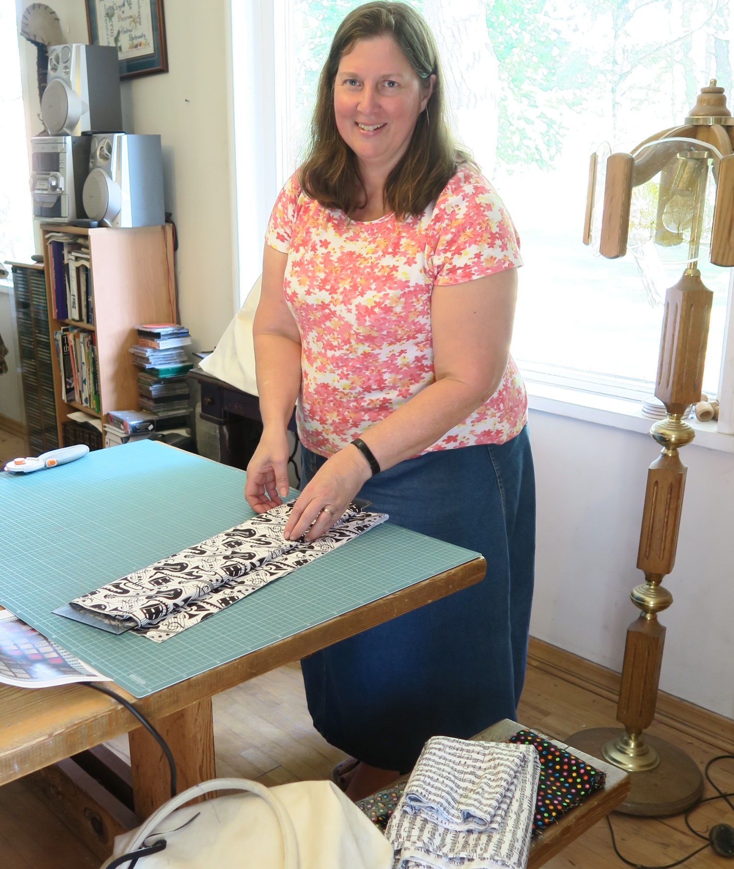 She was determined to fold the extra fabrics and put them back on the shelf where we took them out on Tuesday evening.