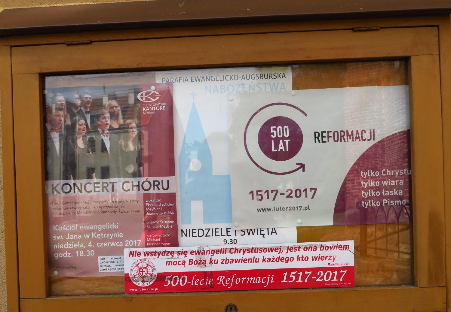 There was a small Protestant church right next to this former-Protestant-but-now-Catholic church. The poster is talking about the 500 year anniversary of the Protestant Reformation. The words says "only Christ, only faith, only grace, only the Bible". 