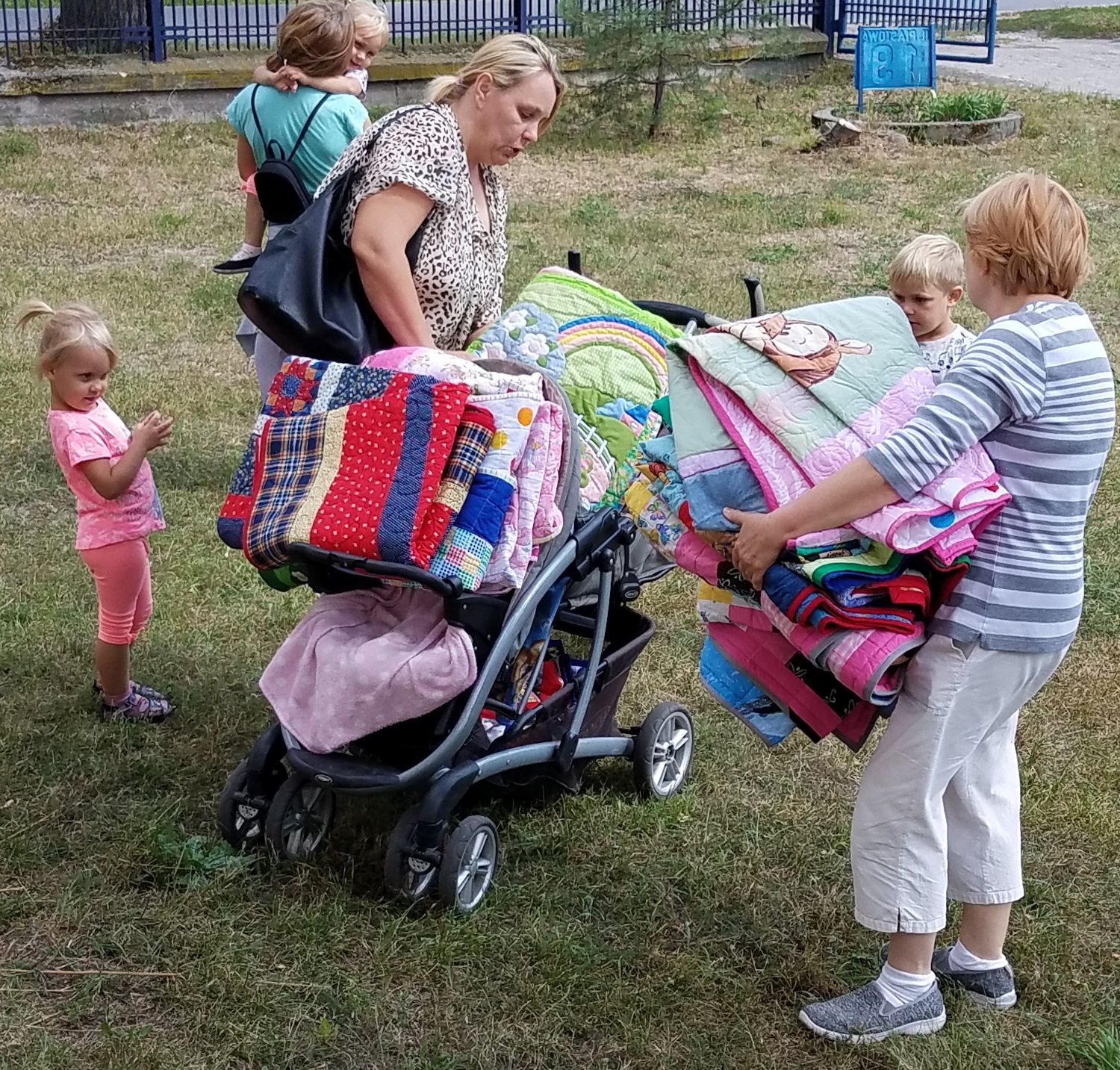 This lady was trying to get 9 quilts on this stroller. She has two sets of twins!