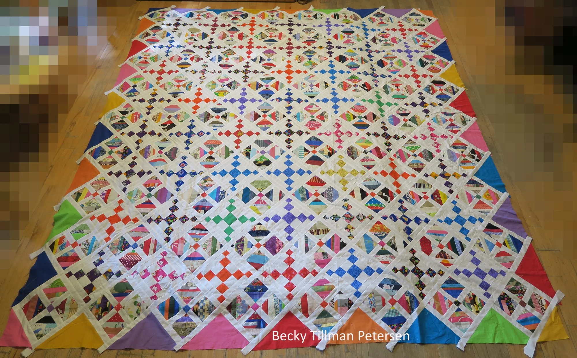 Completed top! I still need to trim off random white strips and trim it down to exact measurements, but I will probably just do that after I quilt it.