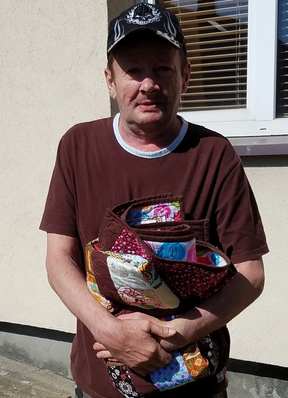 I guess this guy really likes brown as the pink this quilt didn't deter him from choosing this very attractive quilt. I had thought a lady would like it but since I used so much brown in it, a guy took it.