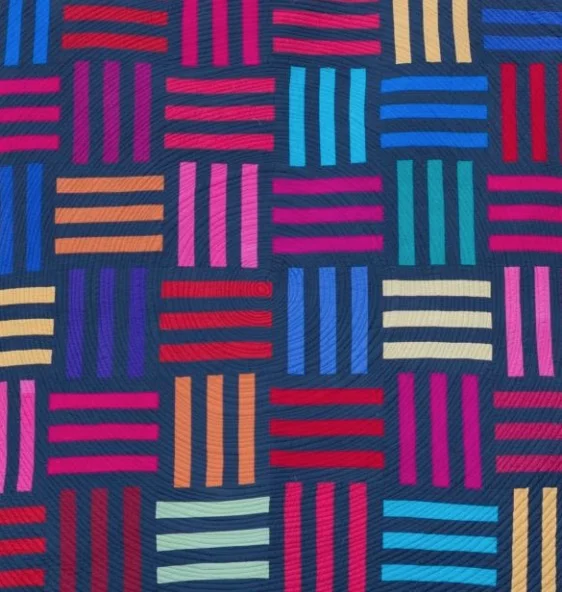 Mod Rails has a modern look to it with its simple design, circular quilting and bold colors.