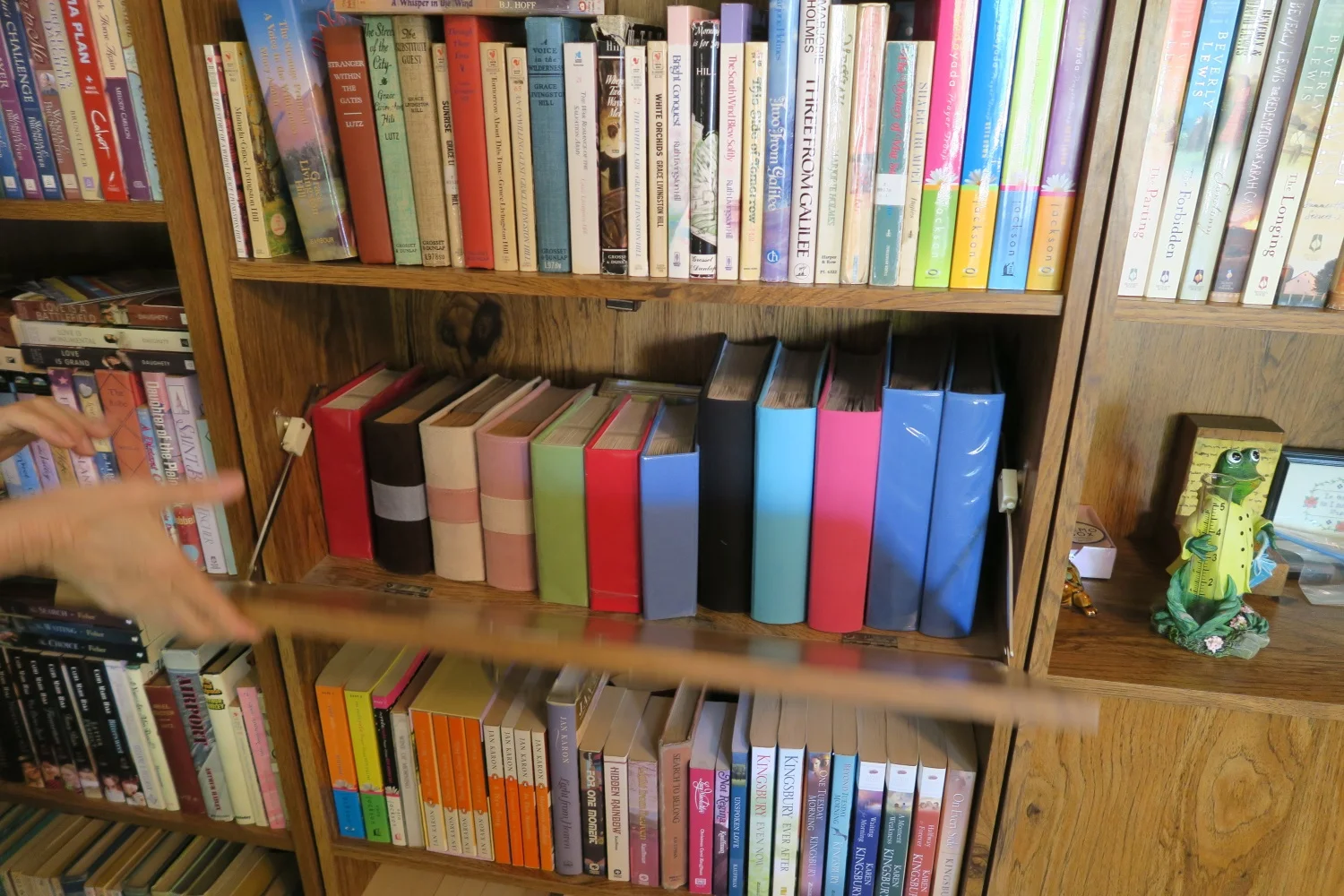 In the middle is her wall of bookcases are her photo albums of all her donated quilts she has made!
