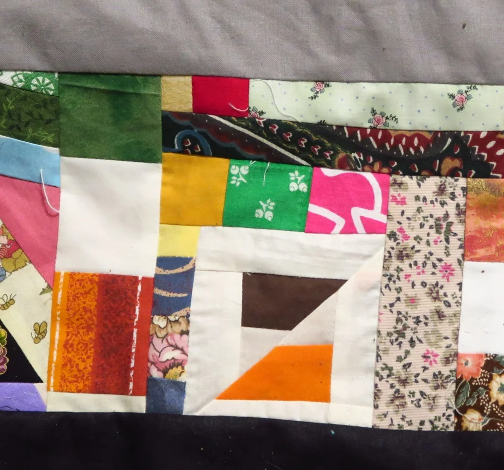 Those off white and orange/brown pieces were part of the edges I had to trim off since I made it on point - the "HI" quilt top I made recently.