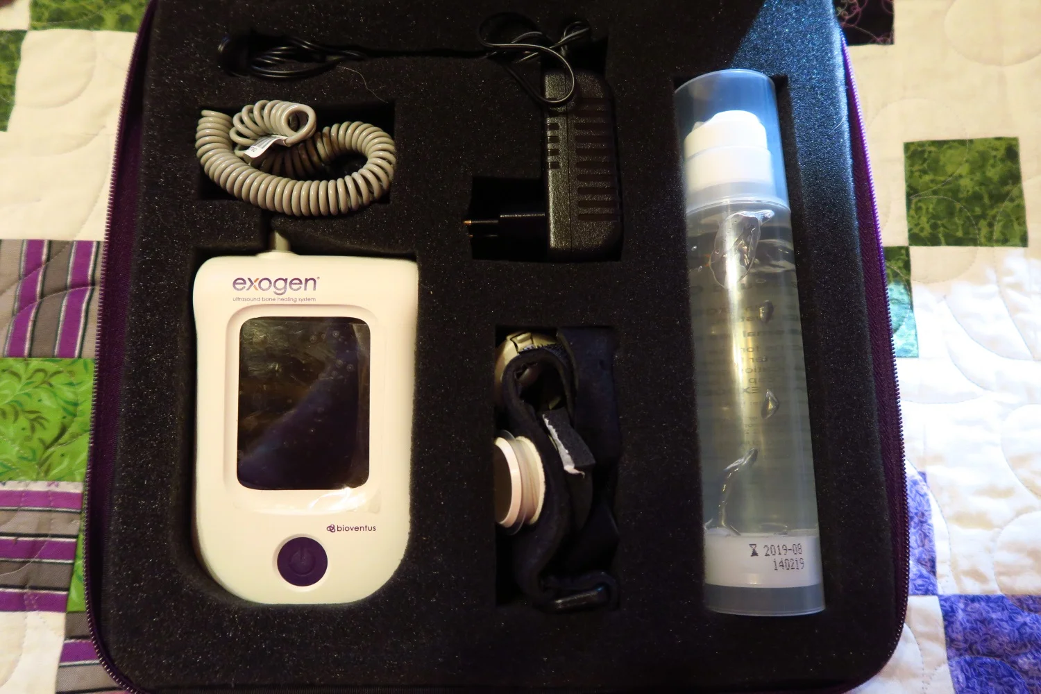 This is the inside of the Exogen box. The machine is the white thing. it is a piece of medical equipment. It's based on ultrasound technology.