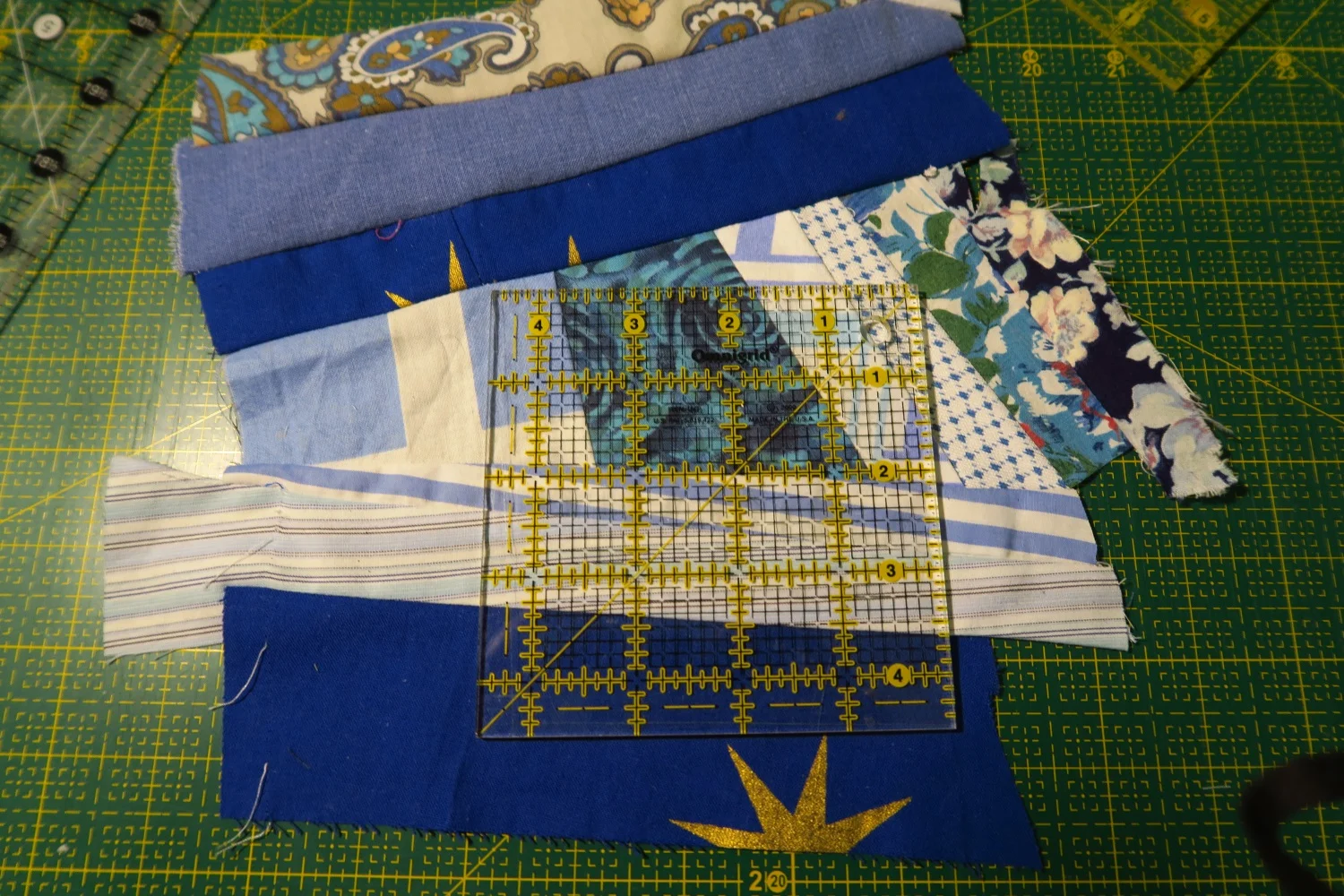 The center crumb block under construction. I actually have a piece of "made fabric" here and am just trying to decide where the most interesting cut should be. I'll use whatever is leftover towards the next crumb block middle.