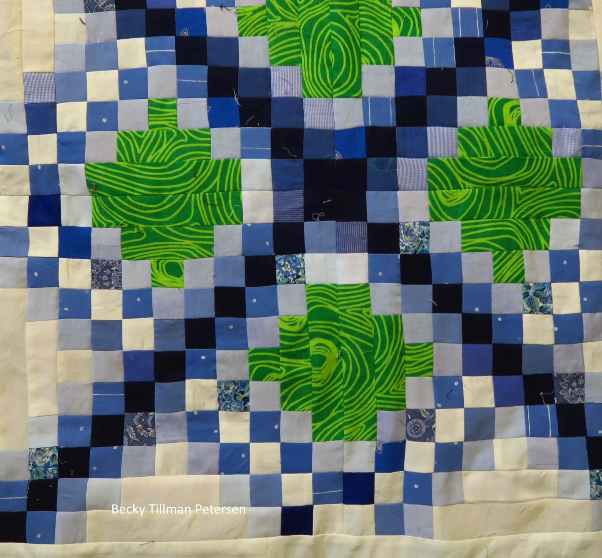 I used a navy blue that was the same throughout. Then on either side of the navy, I used a medium blue and on the side of the medium blue, I used a light blue. My other color was an off white - I used about 5 different ones, I think. The one that I tried to keep consistent was the chain off white - that one I made my "brightest off white".