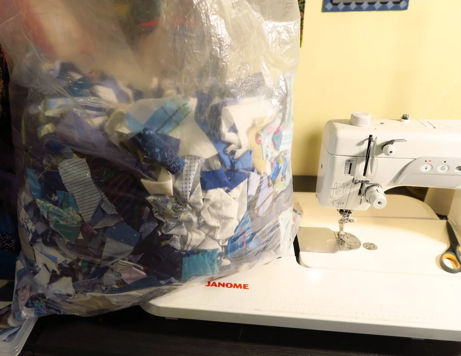 This bag that I'm using to sew on to the adding machine tape is pretty good sized and is over half full of scraps - leftovers from the recently made tops. I may dig through them some more and cut 1.5" strips from them as there are many pieces large enough to do that. We'll see.
