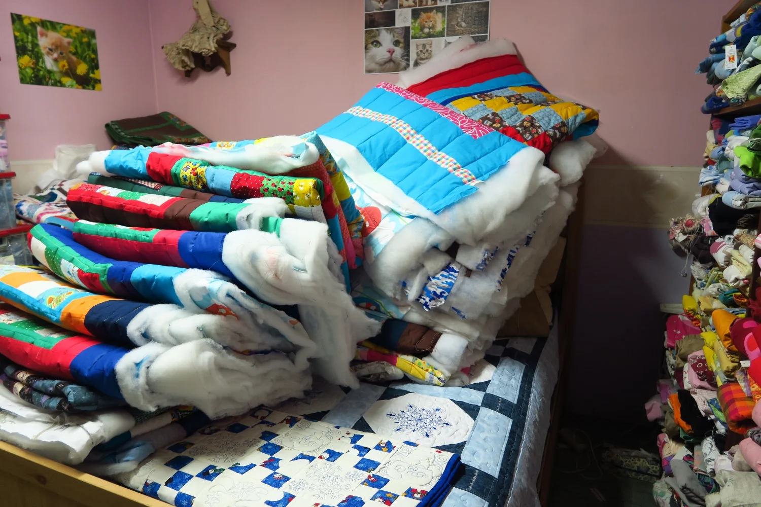 Here are the quilts that I've finished quilting - most of these are straight line quilted though I will FMQ the ones that people in my Facebook group sent me - they are really special and ladies who get those will appreciate loops and twirls more than the kids who are focused completely on the colors.