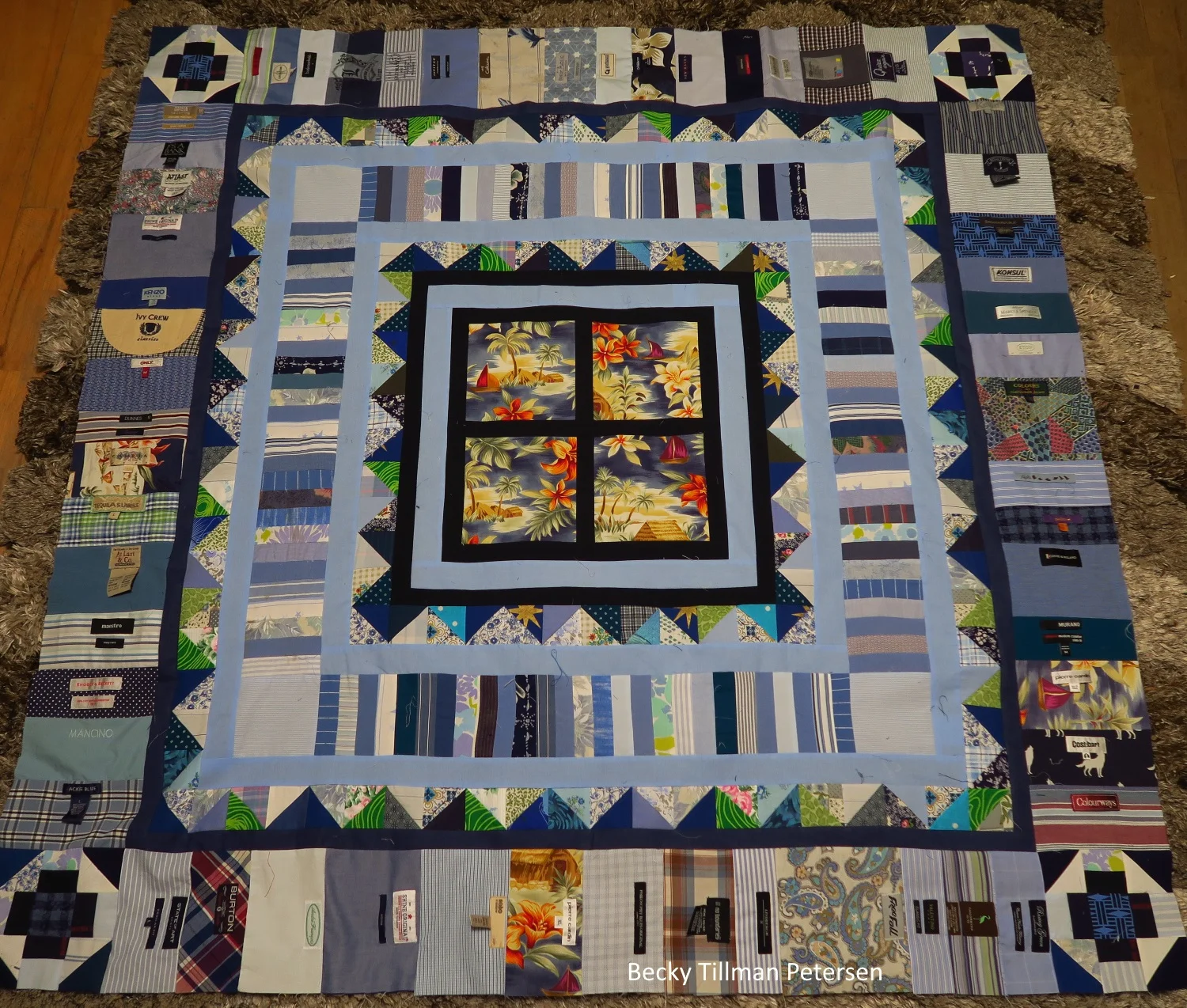 Right now it is 56"x56". Next I'm planning on adding another round of navy blue - and then the rest of my bonus triangles only facing "out". At that point it will be 62"x62".