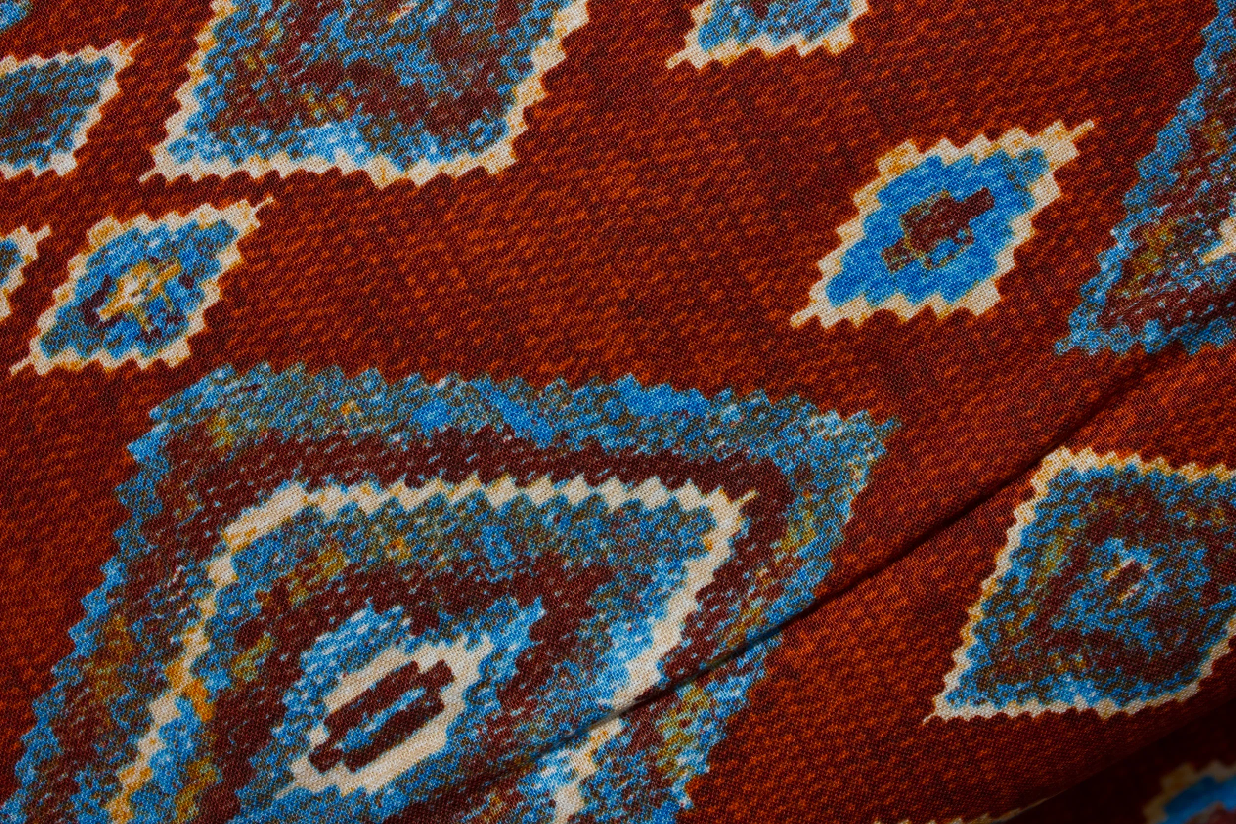 Indian Blanket on Rusty Red by Fabri-Quilt