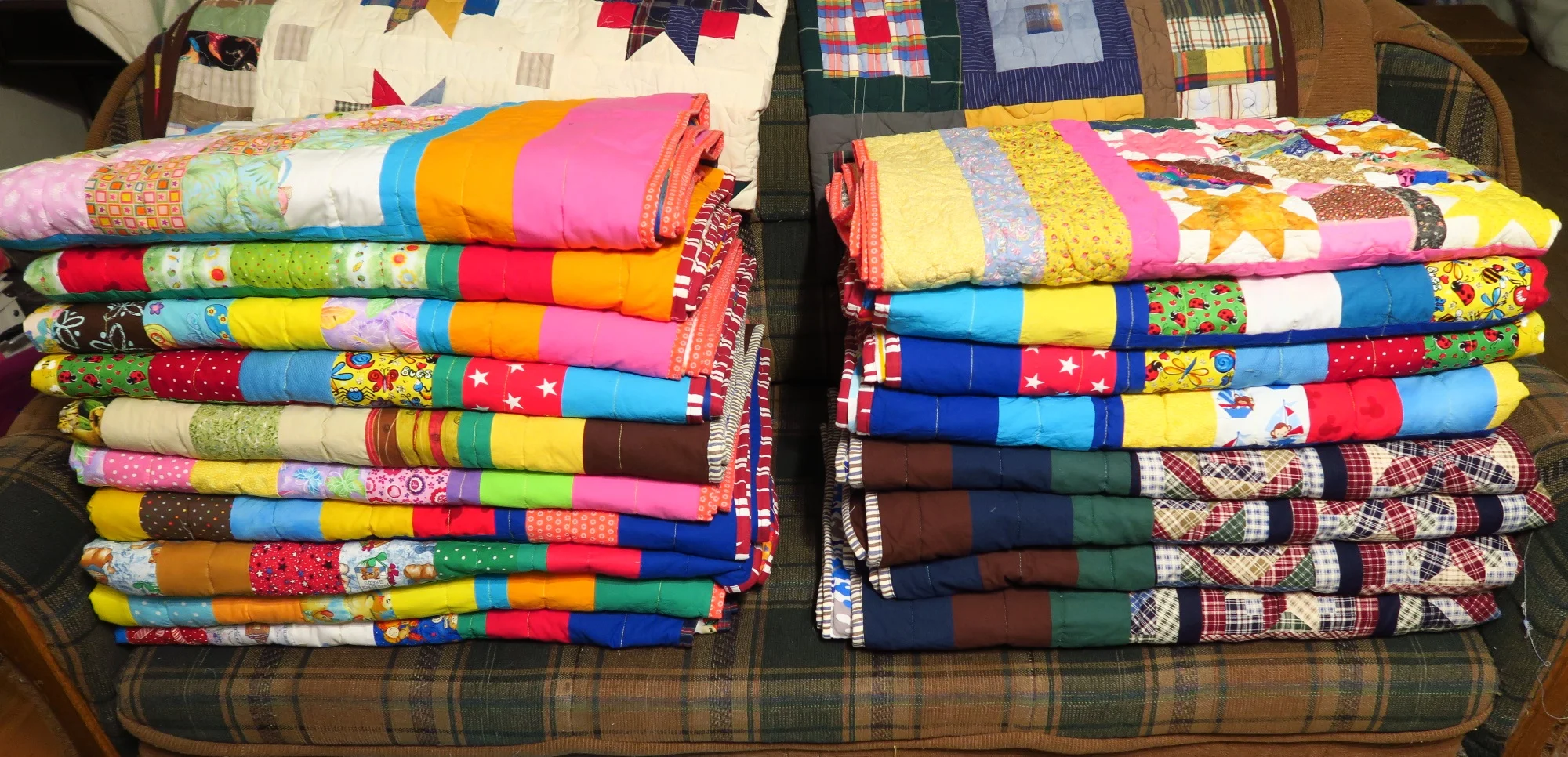 A stack of finished quilts ready to photograph and take out of my house.
