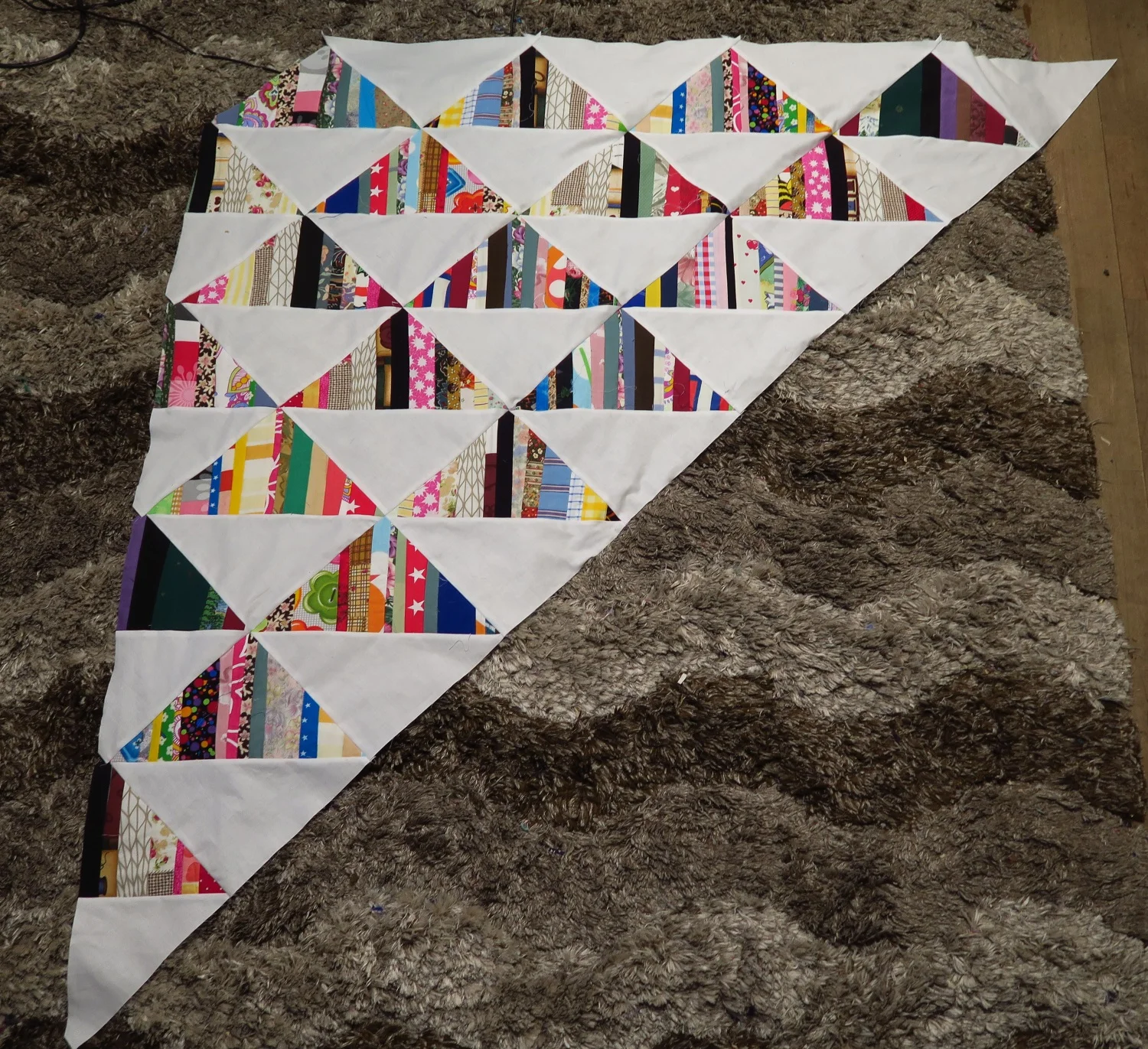 This is what it looks like after they are sewn together. Looking good!&nbsp; I'm going to want to try to get some more string blocks done this week so I have more to play with on the weekend!&nbsp; I'm really liking it!