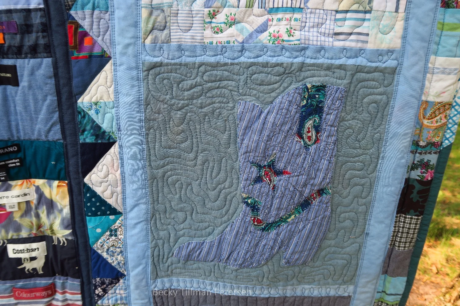 I cut the cowboy boot and various pieces out using my Sizzix die, fused it on and then sewed around. The contrast isn't great here, but it's enough. It makes you look.