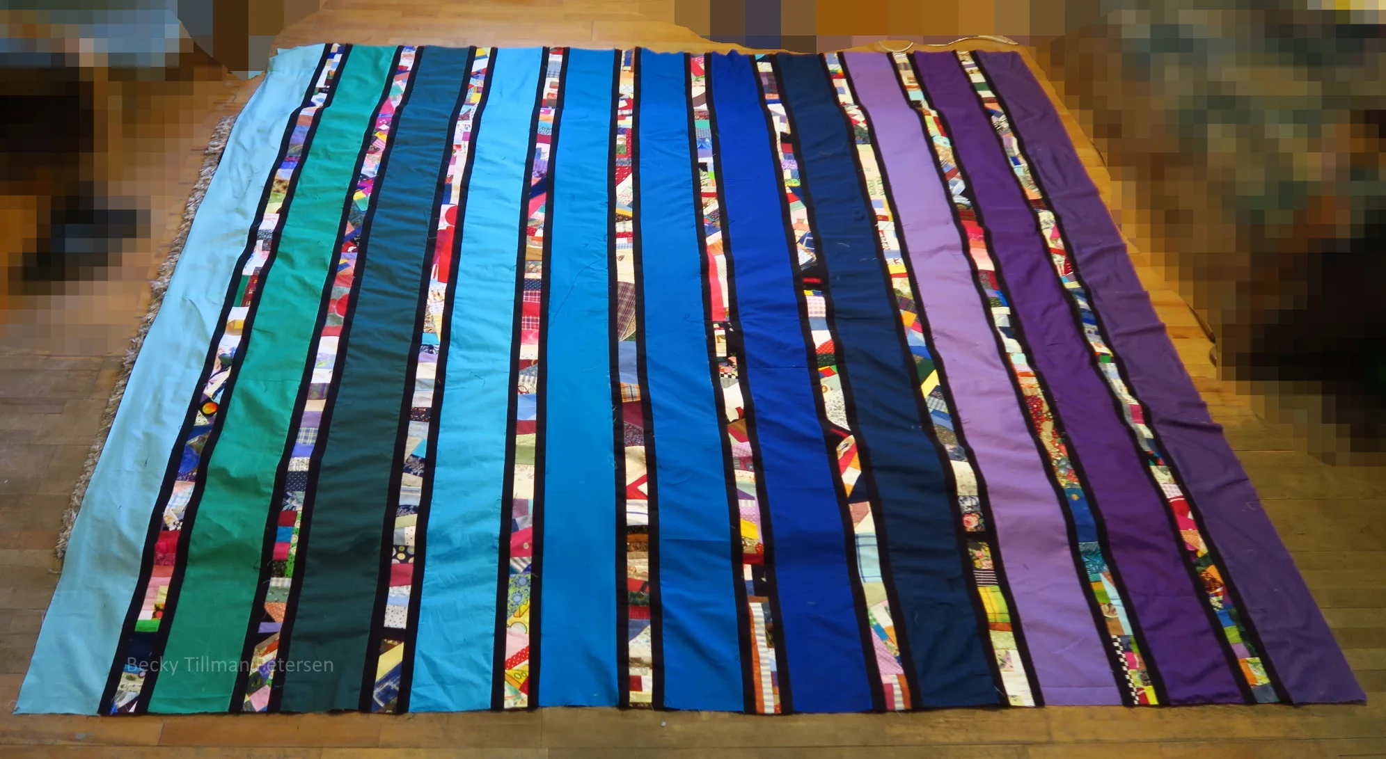 This top actually measures about 102" wide by about 95" long. I just took the picture the wrong direction! Putting it on the bed would work either direction!