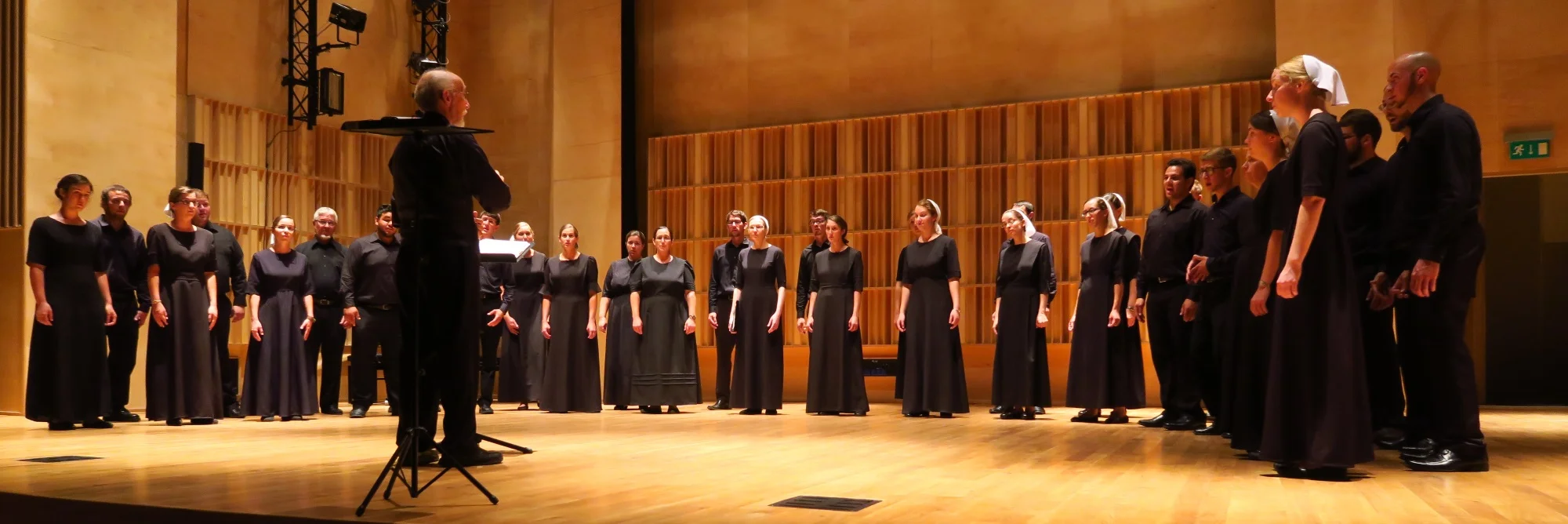 Here is the director and the choir. They sing all a capello, all the time. I'm amazed.