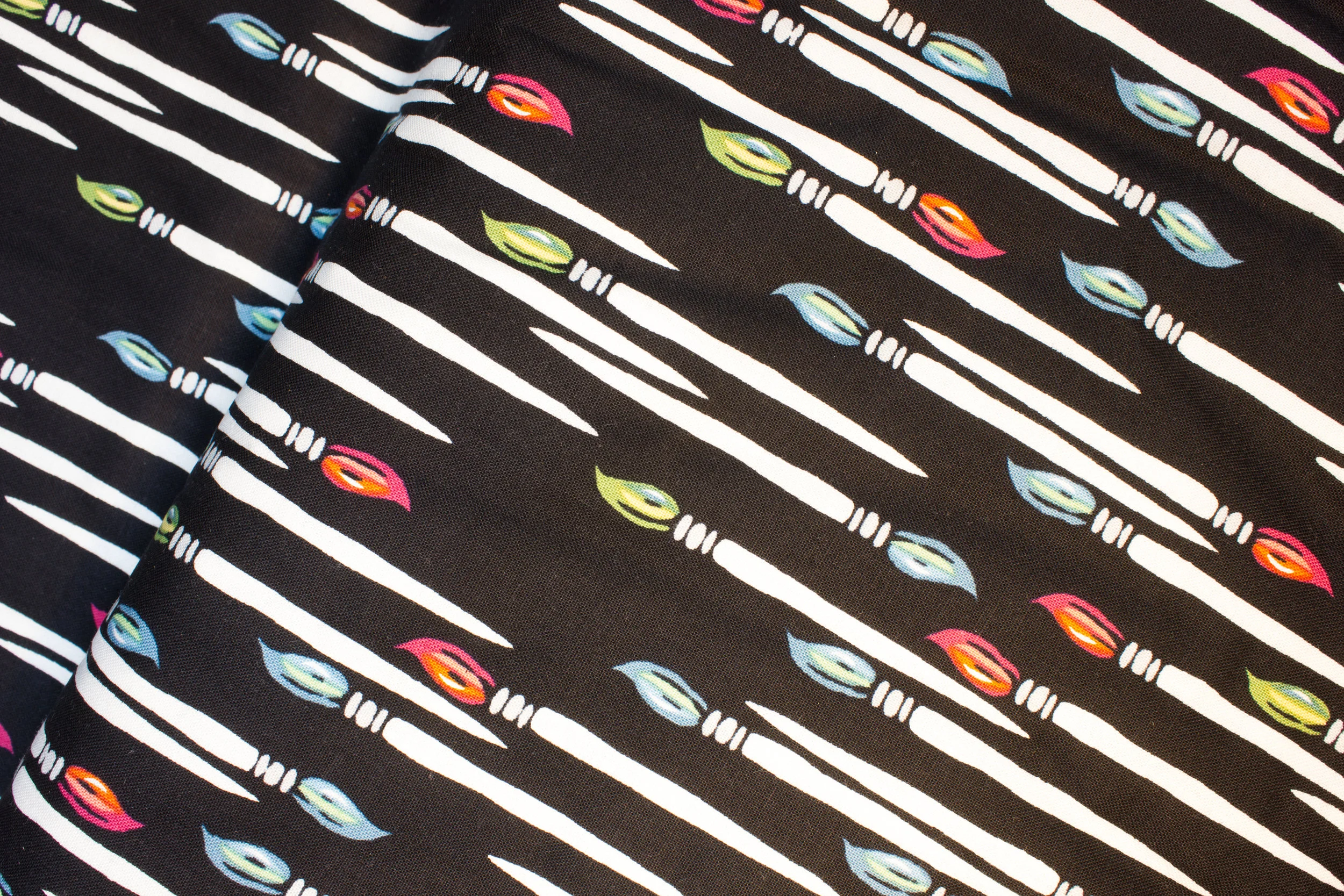 An American In Paris - Paintbrushes on Black - by Andover Fabrics