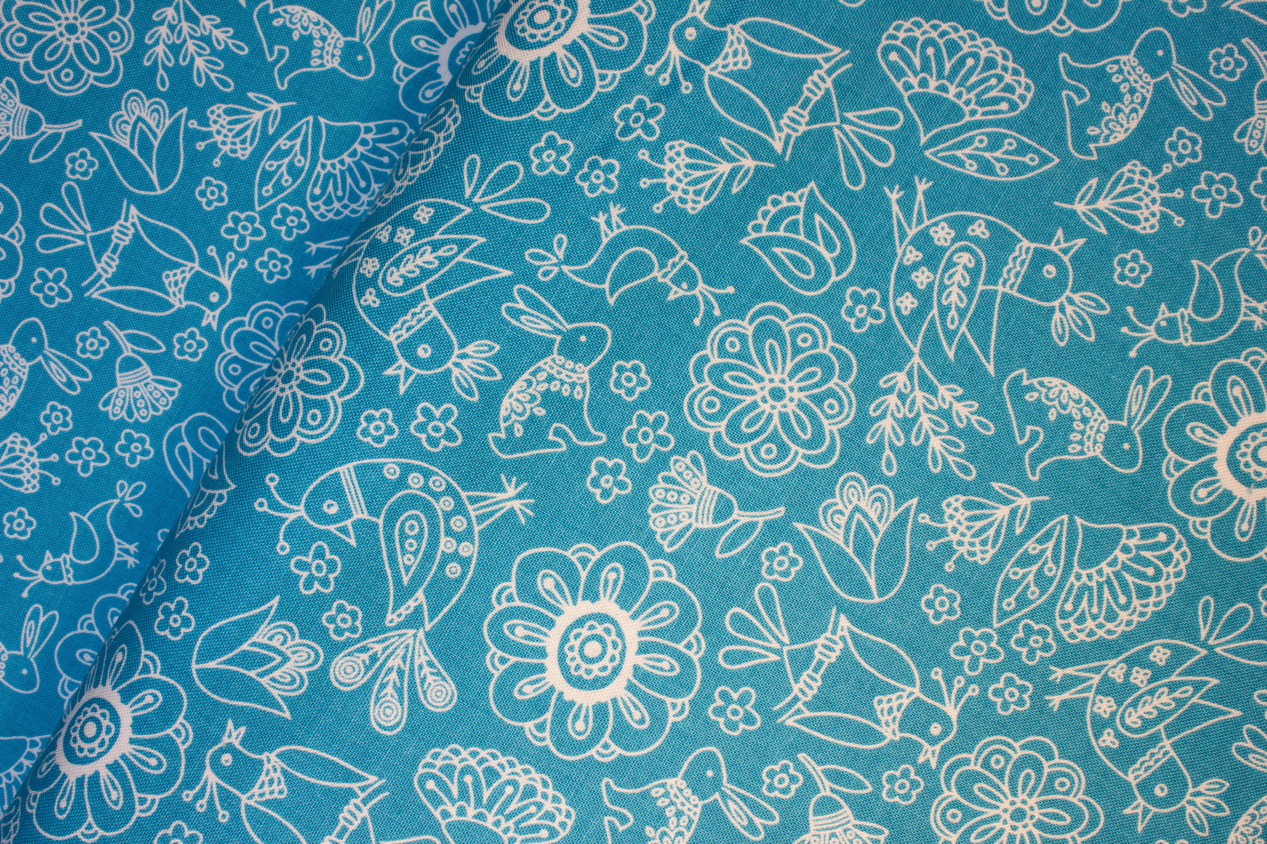 Blue Green with Stylized Birds, Rabbits, and Flowers Outlined in White: Dutch Treat for Riley Blake
