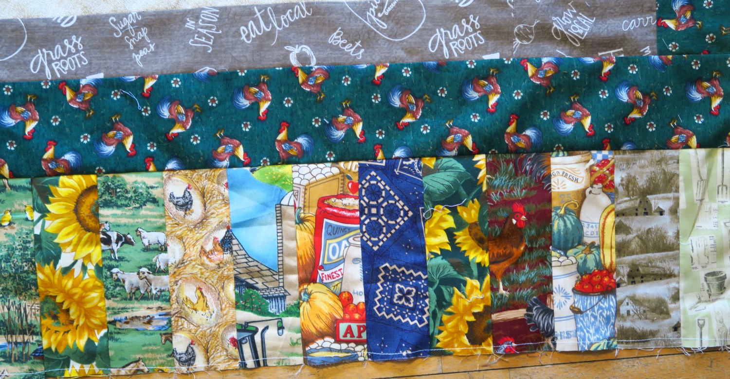 My sis said chickens are very popular fabrics for quilters. Who would have known? I surely didn’t have any idea! I added some fabrics from my stash to help round out the fabrics needed for the piano key border. I had a couple of tiny John Deere pieces leftover from when I made my dad a John Deere quilt years ago, plus I threw in some sunflowers and bandanna.
