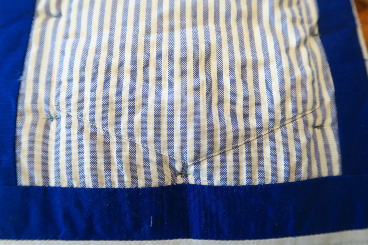 Around the bottom of the pocket