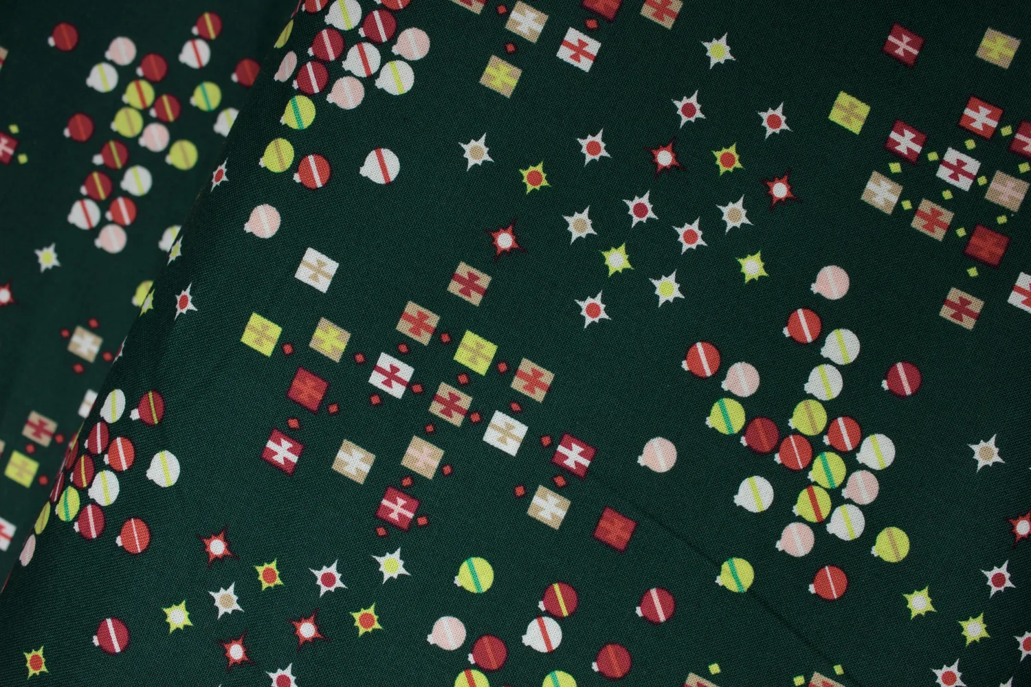 Dark Green with Red, Green, Tan, and White Stars and Presents: Green and Red for Marcus Fabrics