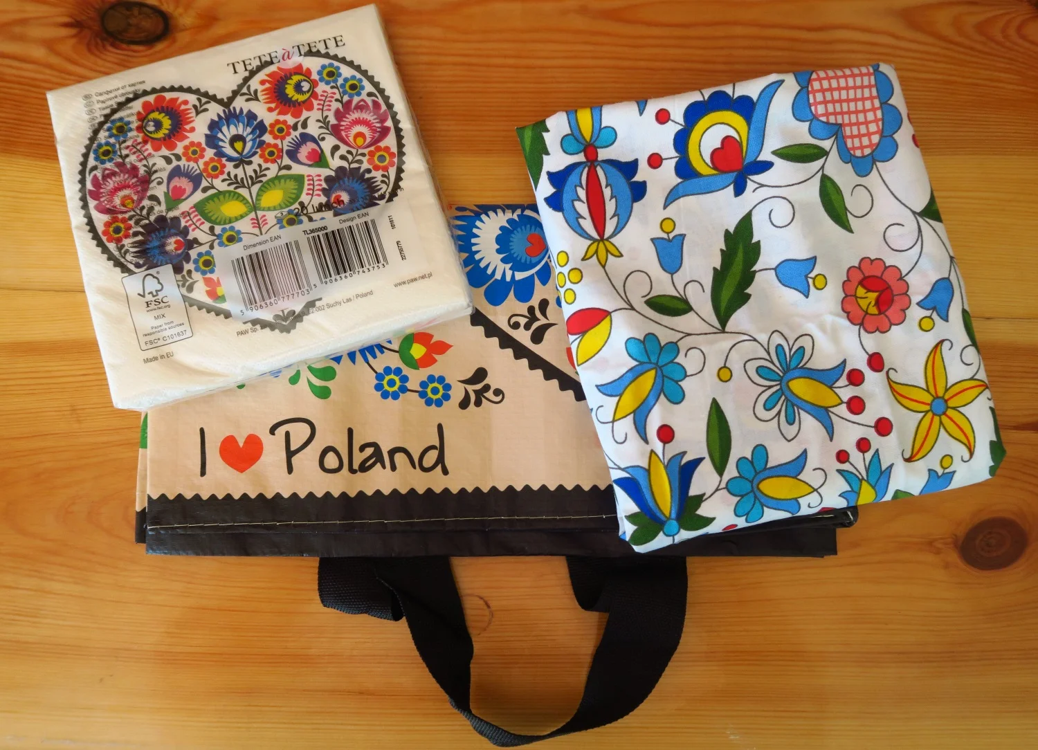 1 A pack of 20 Polish design folk paper napkins, 2. a reusable shopping bag with “I Love Poland” on it and 3. a yard of 62” wide Polish cotton fabric - folk design Kaszubski.