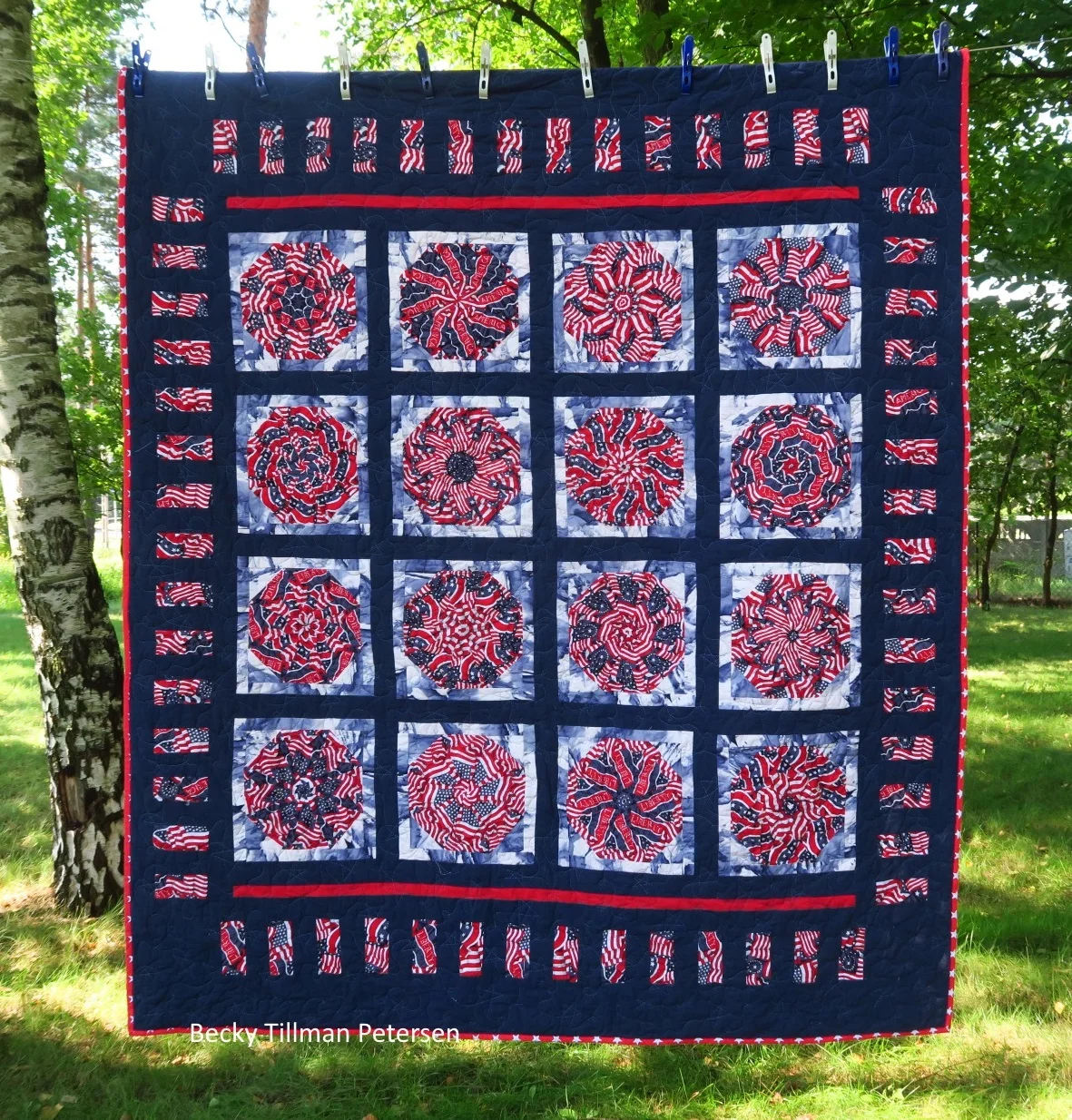 The lady who had the stash that we bought had made these blocks. All I did was finish the quilt - I sashed it, found the coordinating fabrics (well, Rachael did that) and finished it up. It was a gift.