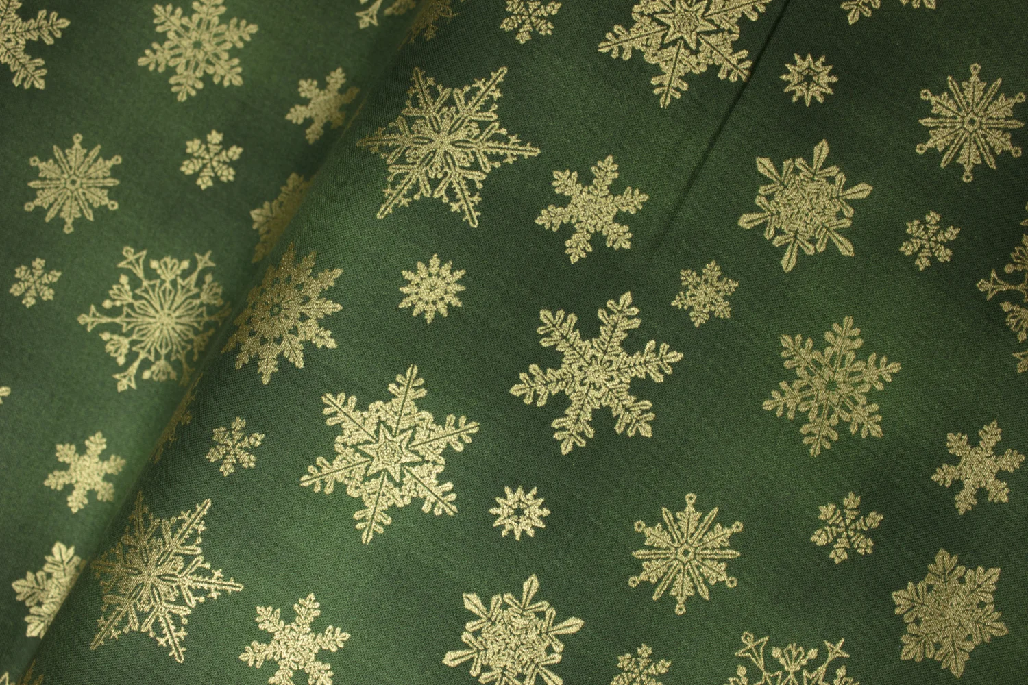 CAT-I-TUDE CHRISTMAS: Playful Flakes: Gold Metallic Snowflakes on Green - by Ann Lauer for Benartex