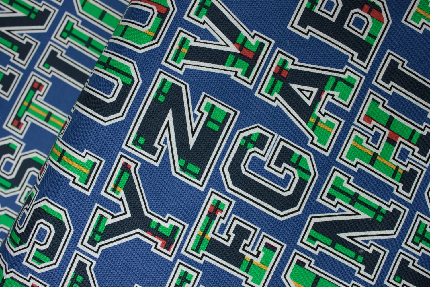 The Letters of the Alphabet in Green, Navy, Yellow, and Red Plaid on Blue: Academic Club by Maria Kalinowski for Kanvas Studio